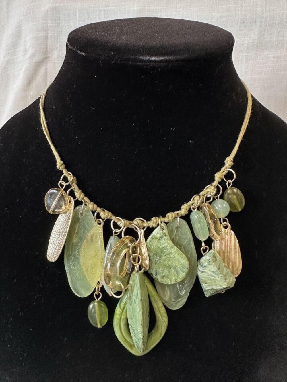 Cookie Lee Green and Gold Tone Charm Dangle Necklace